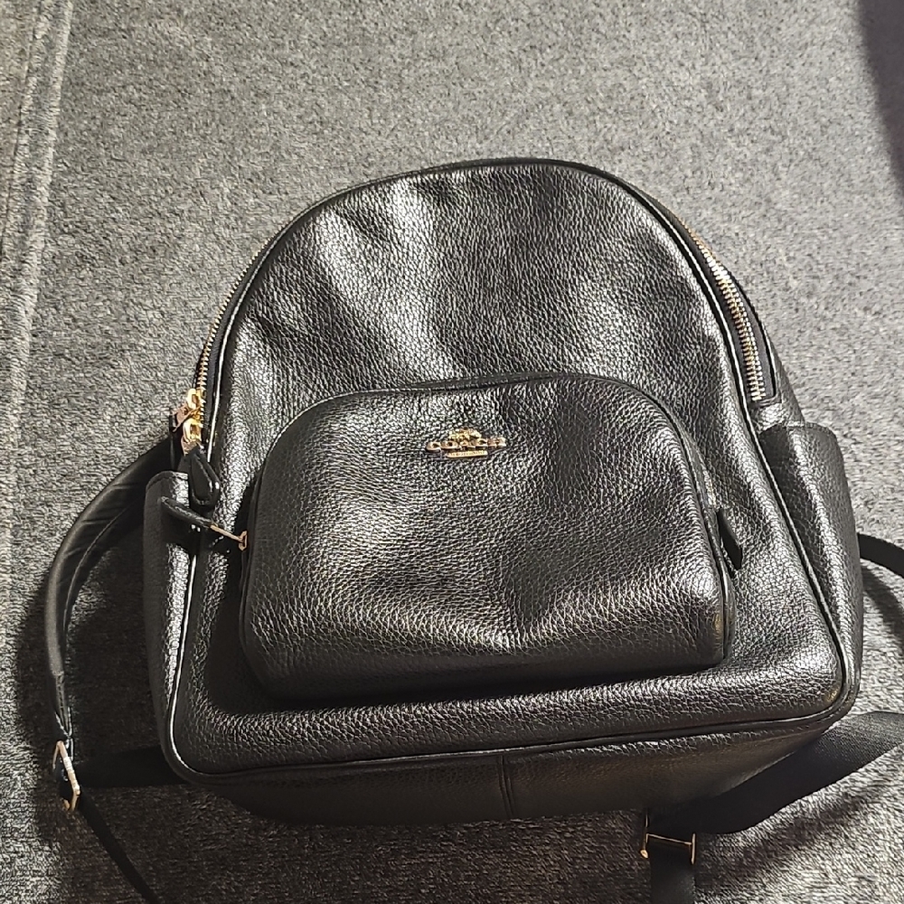 Coach Black and Gold Leather Backpack with Structured Design